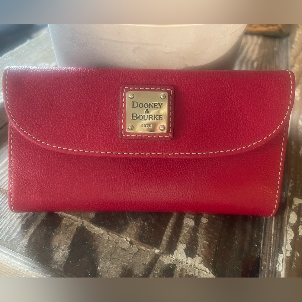 Dooney & Bourke checkbook size wallet.  Never been used.  Red